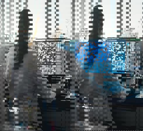 Scientist looking at computer analysis