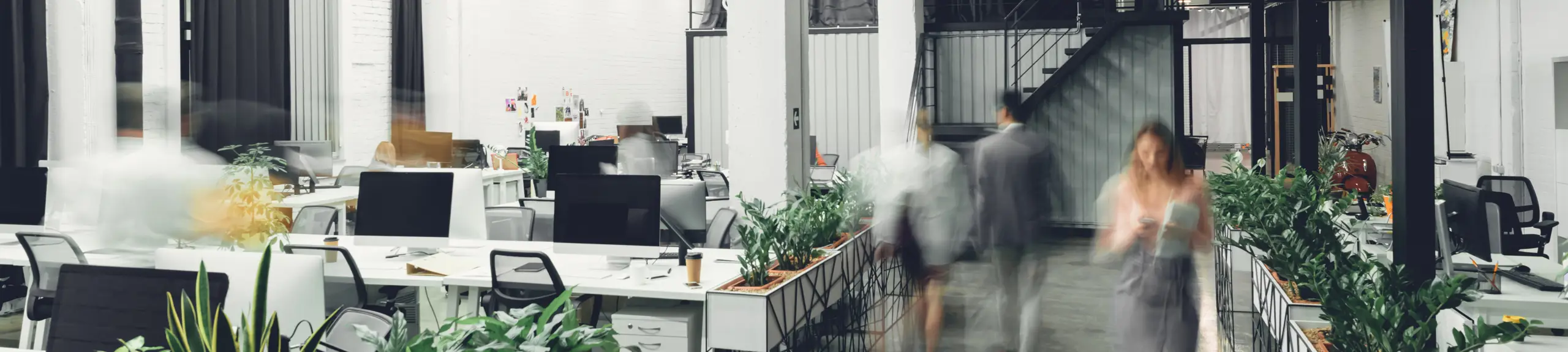 A woman walking in an office A woman walking in an office