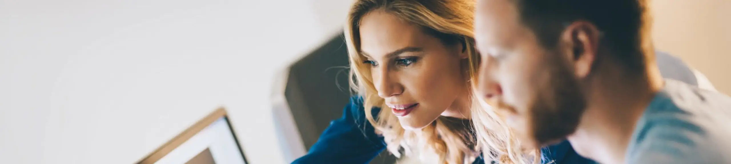 Office workers, working on a computer together Office workers, working on a computer together