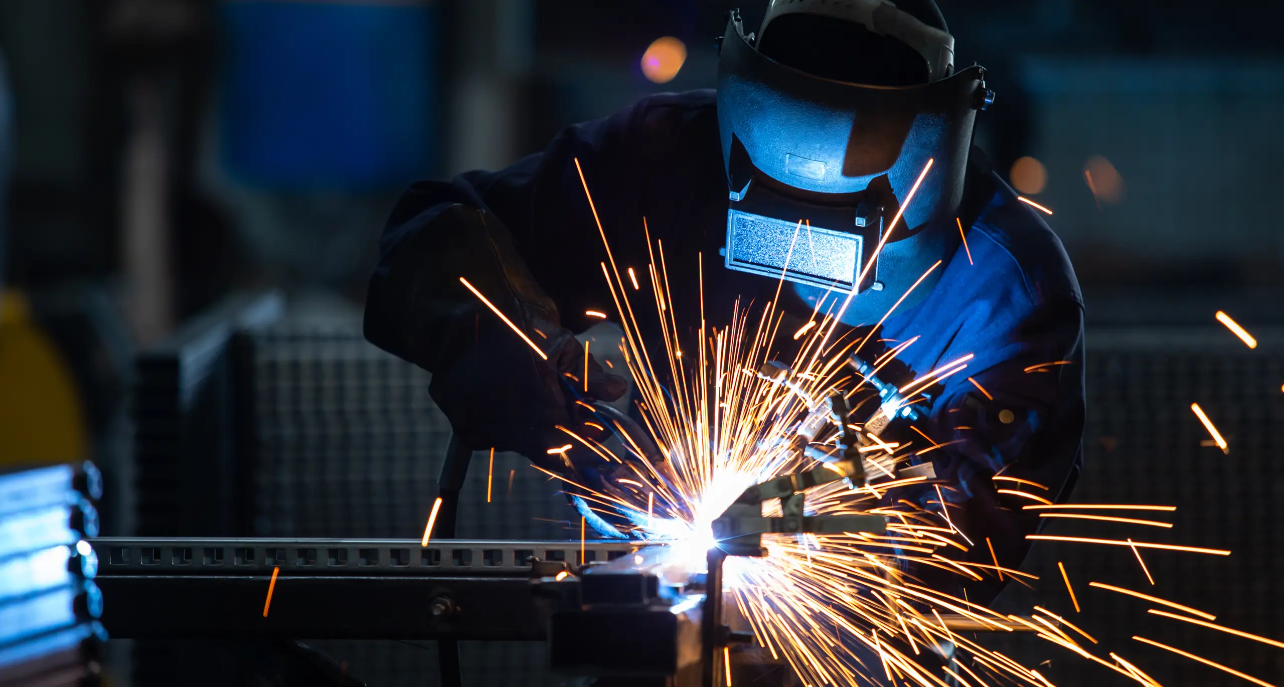 An industrial welder at work