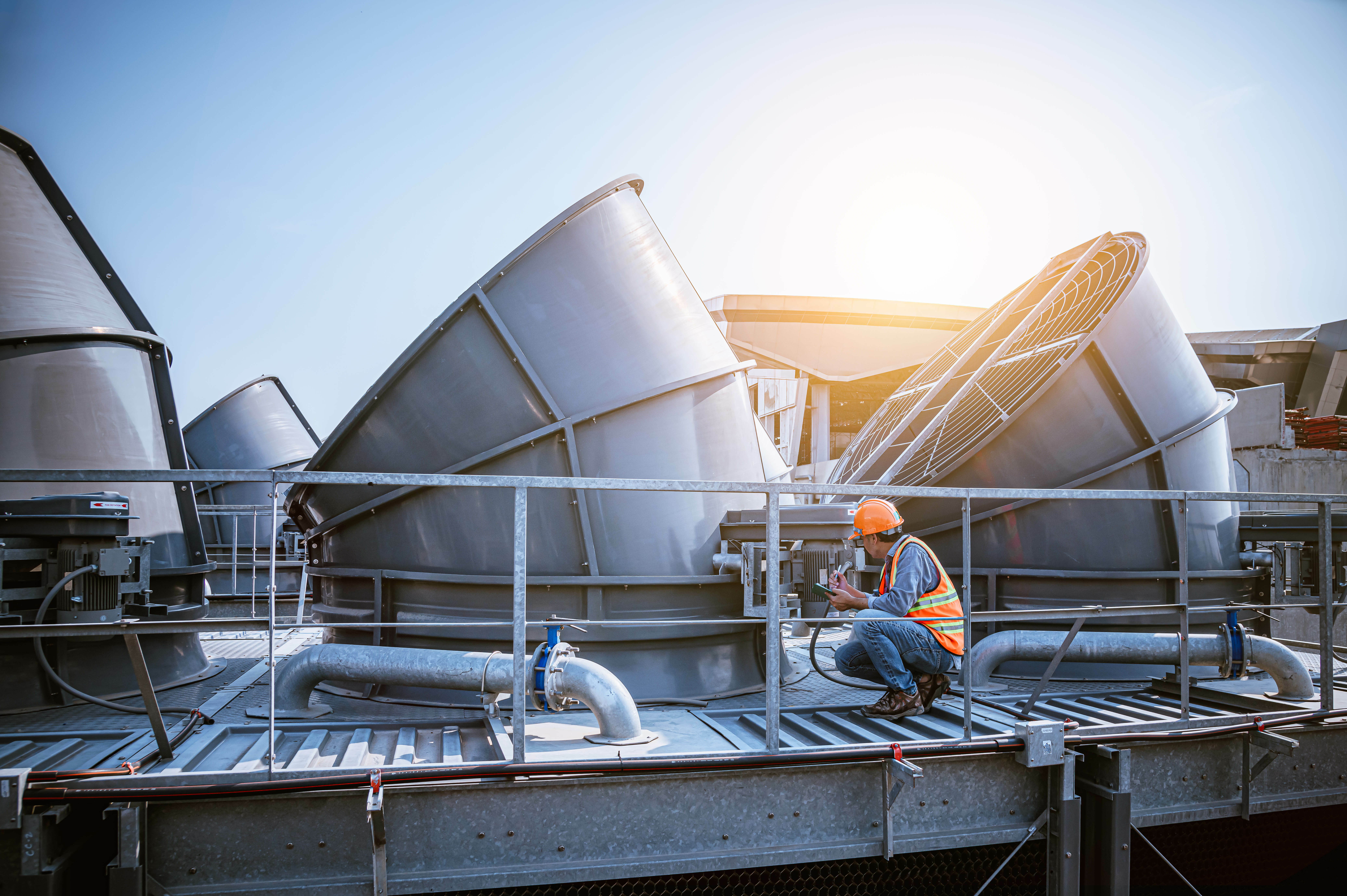 A worker testing external ventilation systems